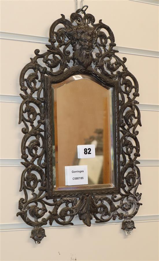 A pewter finish wall mirror, W.24cm., H.38cm